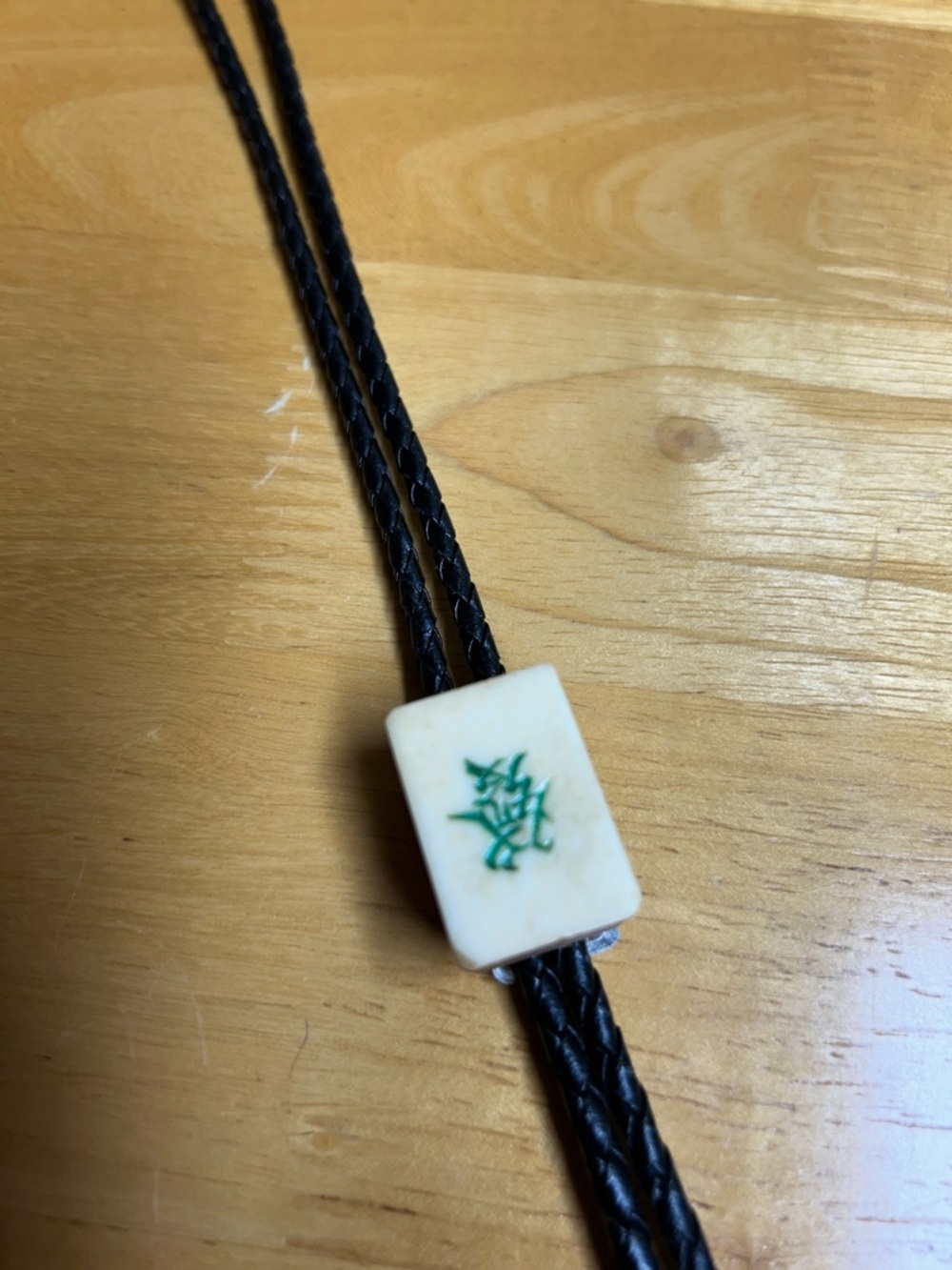 Braided Black Leather Bolo Tie with Ivory Tile and Green Inlay